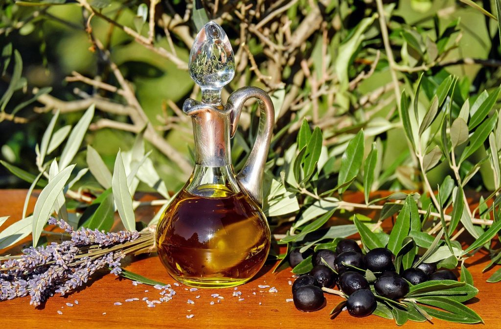 Extra-Virgin Olive Oil bottle and olives – one of the healthiest Edible Oils for heart health